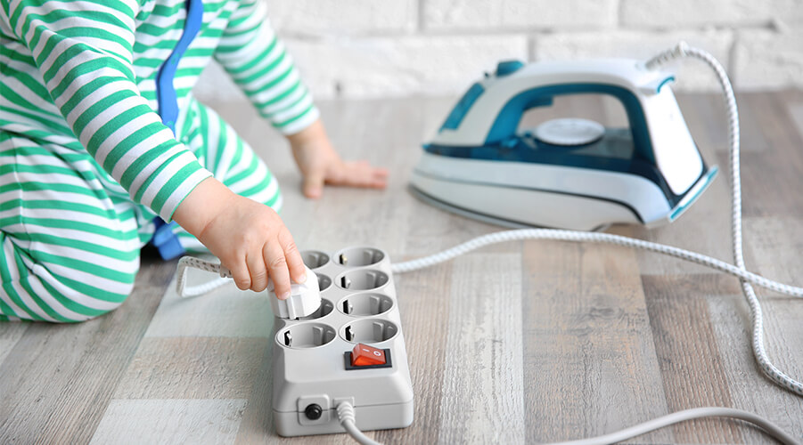 Child Using Electric Outlet