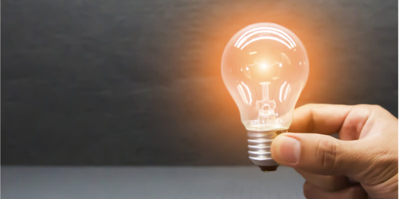 man holding a lightbulb